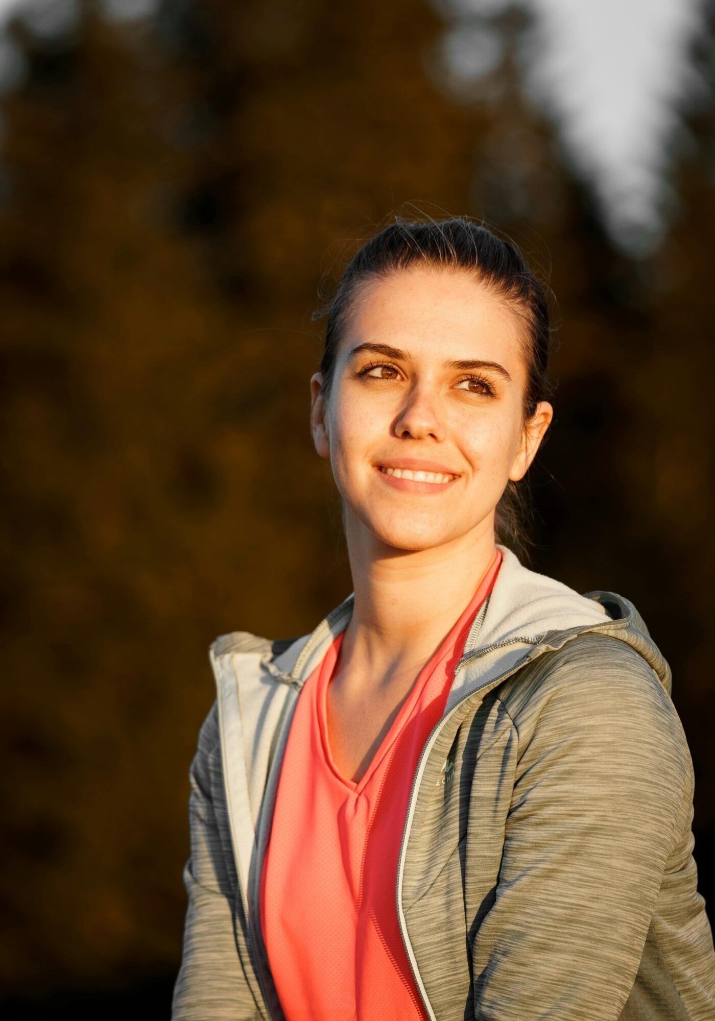 Portrait of a smiling woman enjoying the outdoors in Trentino-South Tyrol, Italy.